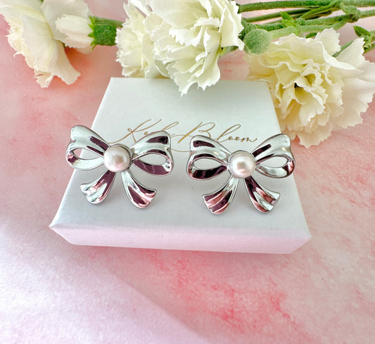 Silver Pearl Bow oversized stud earrings.